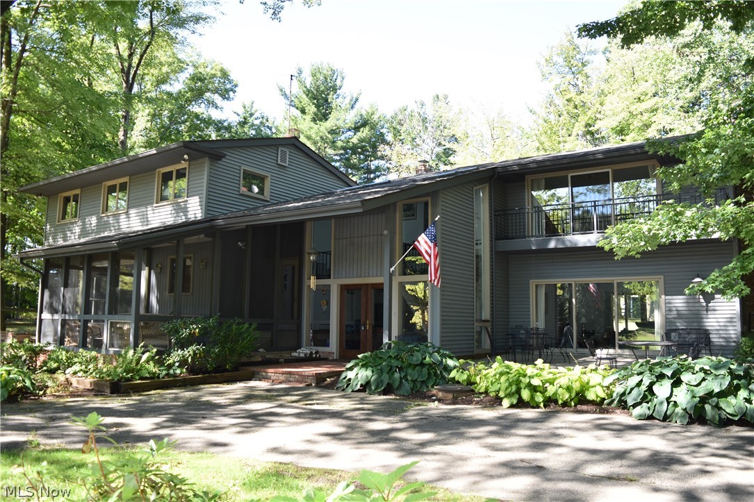 NATURE LOVERS RETREAT on 23+breathtaking acres! Secluded, private and set back 700 ft from the road, this 6500+sqft home includes a massive 2500 sqft indoor pool addition. This spacious custom home offers 4 Bedrooms, 4.5 Baths, bright & inviting 2-story foyer, 2 brick wood burning fireplaces, 2 staircases, Great Room, Eat-in Kitchen, Family Room, huge Master Bedroom with private balcony overlooking the lake, 1st floor Office or 5th bedroom, Screened-in Sun Porch, 1st floor Laundry Room, Mudroom & 2-car attached garage. Roof approx. 10 yrs old. The Incredible 50x18 Indoor Pool is surrounded by stunning floor to ceiling flagstone, tongue & groove wood ceiling, multiple sets of french doors, wet bar, full bath with ceramic shower & cedar built-in sauna. Enjoy the outdoors and views of nature & wildlife from every window, patio, porch or balcony overlooking the 2+acre stocked lake with small beach & dock for fishing, swimming or paddle boating. Hunt or make your own riding and walking trails in acres of mature woods with ravine, waterfall, creek & stream. 36x30 2-story horse barn with attached 30x18 annex, 5 stalls & tack room, 38x26 outbuilding for additional cars or equipment, fenced pastures & outdoor arena. Just minutes to freeway access. Drive down the winding tree-lined driveway to this beautiful quiet & serene setting, ideal for your family's home, getaway retreat, equine farm or bed and breakfast....Possibilities are endless with this one-of-a kind property.