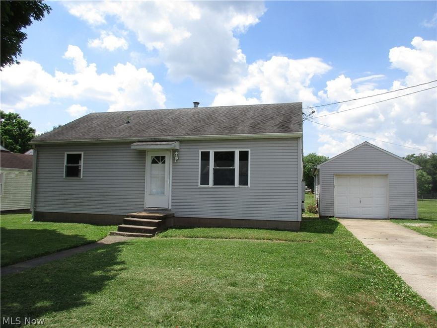 This "cute as a button" ranch home in Devola offers the convenience of one floor living.  Original hardwood floors throughout the house except for the bathroom.  The spacious living room offers plenty of light flowing throughout.  The cute updated kitchen features cheery white cabinets, over the range microwave and a lovely tile backsplash.  The kitchen has access to the large level backyard.  The master bedroom is spacious with two additional bedrooms and an updated bath.
Laundry area is conveniently located.  The home offers newer vinyl siding, roof, windows, HVAC, water heater and updated electric for maintenance free living.  The one car garage is deep for extra storage space.  This would be a great starter home or investment potential.   M729