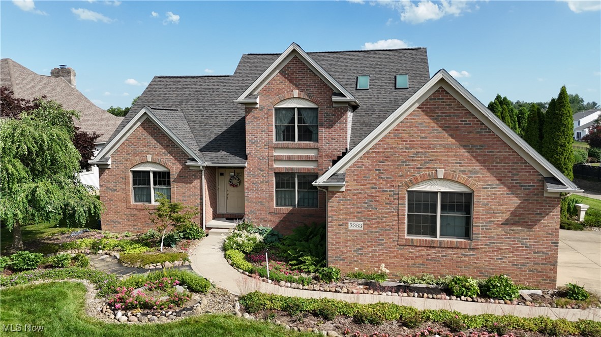 Welcome to 3383 Suffolk Downs in the prestigious Pambi Farms Estates, where thoughtful design meets serene golf course living. This 3-bedroom, 2.5-bath brick-front contemporary home offers over 2,600 square feet of living space and sits on a meticulously landscaped lot backing to the 2nd hole of the front 9. Step into the airy two-story foyer with vaulted ceilings, a grand staircase, and an open layout ideal for entertaining. The large living room features a gas fireplace, while the eat-in kitchen boasts solid wood cabinetry, a center island, pantry, and plenty of counter space with views of the backyard garden. A formal dining space is also available for hosting gatherings. The First-Floor Primary Suite includes his and her closets, soaking tub, standing shower, and large vanity. Upstairs, you’ll find two spacious bedrooms, each with large closets and a full bath. Enjoy the tranquility of the professionally designed bird and butterfly garden, created by a master gardener, complete with winding paths, raised beds, and scenic golf course views. From the expansive windows and back patio, take in the picturesque view of the lake, with no direct neighbor behind you, offering peace and privacy. When you walk out the front door, you’ll be greeted with another serene view of the golf course, making every side of this home a window to nature. Additional highlights include a wheelchair-accessible 2-car attached garage, Roof (2022), AC (2014),Furnace (2020) First-Floor Laundry, and a full basement with loads of storage space. This is more than just a home—it’s a lifestyle in a serene, suburban neighborhood curated for families, recreation, and nature enthusiasts. Don’t miss your chance to become part of the sought-after Pambi Farms community—close to Roses Run Country Club, Metro Parks & Trails, retail, dining, and more. Schedule your private tour today!