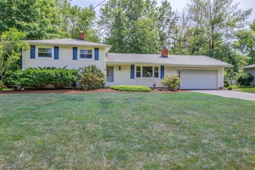 Spacious split offers over 1500 square feet. Features vaulted living room with fireplace. Beautiful updated kitchen with designer cabinets, dining area off the kitchen with sliding door to large deck overlooking fenced backyard. Lower level family room 18x16. Laundry room area. 2 car attached garage. Central air. Close access to highway from route 306.