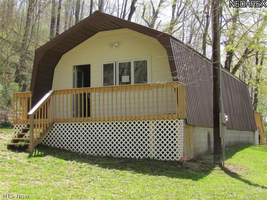 River access. Property is being offered as is unfinished. 5+ acres on Bucklew Run, 419' creek frontage, at the junction of the Killbuck and Walhonding river. Up grades include metal roof, cement siding, windows, doors, decks, electric to house. Well and Septic are disconnected during remodel but functioned when purchased.Spring on hillside. Possible hillside home site.