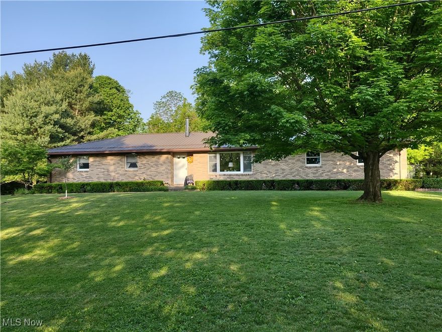 This 4-bedroom, brick ranch is conveniently located just off St Rt 40 between Cambridge & Old Washington and only a few miles from the Interstate.  This well cared for home features a newer metal roof, a freshly paved driveway, Anderson windows, a wood burning Earth Stove and is on a dead-end street.  Just off of the kitchen you will find a seasonal room, perfect for sipping coffee in the mornings or just sitting in the evenings listening to the wildlife without the hassle of the bugs.  The partially finished basement provides for plenty of storage and room for extra living. Outside the current owners have raised several mature fruit trees and just love the spacious, level yard. County water is available.