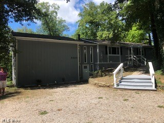 Very unique home that has everything, updated with new doors, windows, bath rooms with fixtures, floor coverings, media/theater room, atrium, painted inside and out, two large decks, new garage doors, gutters, nice 2.48 ac treed lot