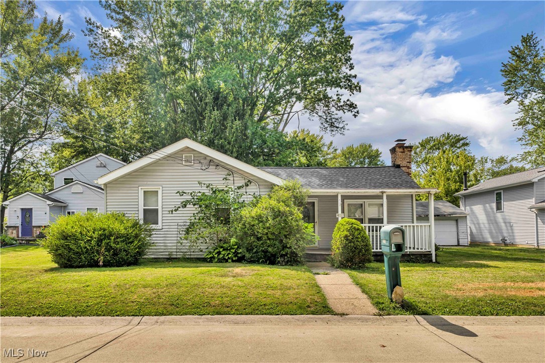 Investor Special or Handy Homeowner Opportunity! This ranch-style home offers convenient one-floor living and is full of potential. Features include three bedrooms, one full bath, and a living room with a cozy wood-burning fireplace. Kitchen appliances—range, microwave, and refrigerator—are included. Enjoy the open front porch, perfect for relaxing, and a nice-sized backyard with mature trees providing extra shade. The detached two-car garage includes a garage door opener for easy access. The roof is approximately 11 years old. HOME NEEDS WORK AND IS PRICED WELL BELOW MARKET VALUE --- GREAT CHANCE TO BULID EQUITY! Located close to schools, shopping, and easy highway access to I-480, the Ohio Turnpike, and I-90. SELLER WILL MAKE NO REPAIRS, HOME SOLD "AS-IS".