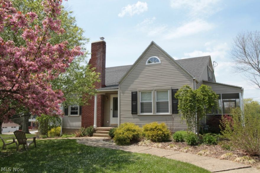 Immaculately maintained modernized home just on the corner of the quaint village on New Concord is ready for its new owners!  You will love the updates throughout the home while still offering classic charm. Updates include roof, siding, windows and doors, chimney liner with lifetime warranty, and fireplace with gas logs to help with warming! Large finished upper level is a nice surprise and would make an excellent 4th bedroom with a full bath, or a nice family room. Kitchen features cherry cabinetry and you will appreciate the newer updates such as roof, siding, windows & central air. Nice screened in porch opens up to a beautiful patio area with privacy fence.