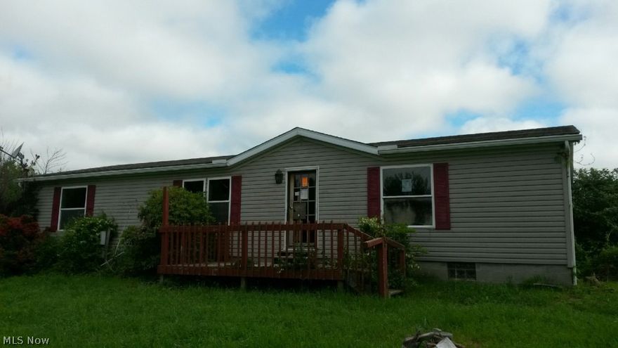 3 bedroom manufactured home w/ addition. 3 decks, 2 car detached garage all on a1+ acre lot with a country setting.
