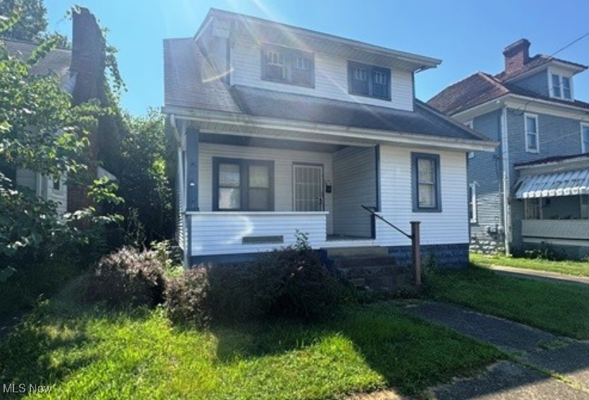 This charming bungalow style home offers excellent potential in the heart of Parkersburg. This 3 bedroom, 1.5 bath home features a spacious layout with original woodwork, trim, built-ins, and a fireplace that add to its charm. A large covered front porch welcomes you, while the detached one-car garage, alley access, and off-street parking provide convenience. Located near City Park, downtown dining, shopping, and riverfront attractions, this property offers both character and a central location. Ideal for do-it-yourself buyers, investors, or those utilizing renovation loans, this home is ready for updates and finishing touches to bring it back to life.
