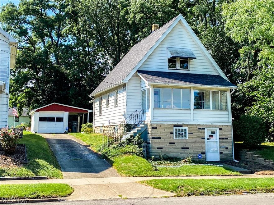 Don’t miss this adorable Cape Cod located on the west side of Youngstown! This home is the last house next to an vacant wooded corner lot offering lots of privacy any owner can enjoy!  NEW ROOF 2019, WATERPROOFED BASEMENT, UPDATED ELECTRICAL, NEWER HWT, FURNACE SERVIED IN 2019 WORKS GREAT.  ADT SECURITY SYSTEM, UPDATED DOUBLE PANE WINDOWS THROUGHOUT, GLASS BLOCK WINDOWS IN THE BASEMENT WITH CHANGEABLE DOUBLE PANE WINDOWS, GLASS, AND SCREENS!  One Car Detached Garage with a built-on shed and covered cement slab porch!  Garage has lighting and power and a newer electric Opener.  Kitchen Cabinetry is original but functional.  First Floor Full Bath with large tub, solid oak Medicine Cabinet and Vanity.  .  Living room and Family Room/Dining Room are nicely sized and very Spacious. Covered Front porch has screens and glass windows all the way around overlooking a nicely maintained open lot owned by the church adjacent to the property. Bedroom one is smaller and located on the main level and