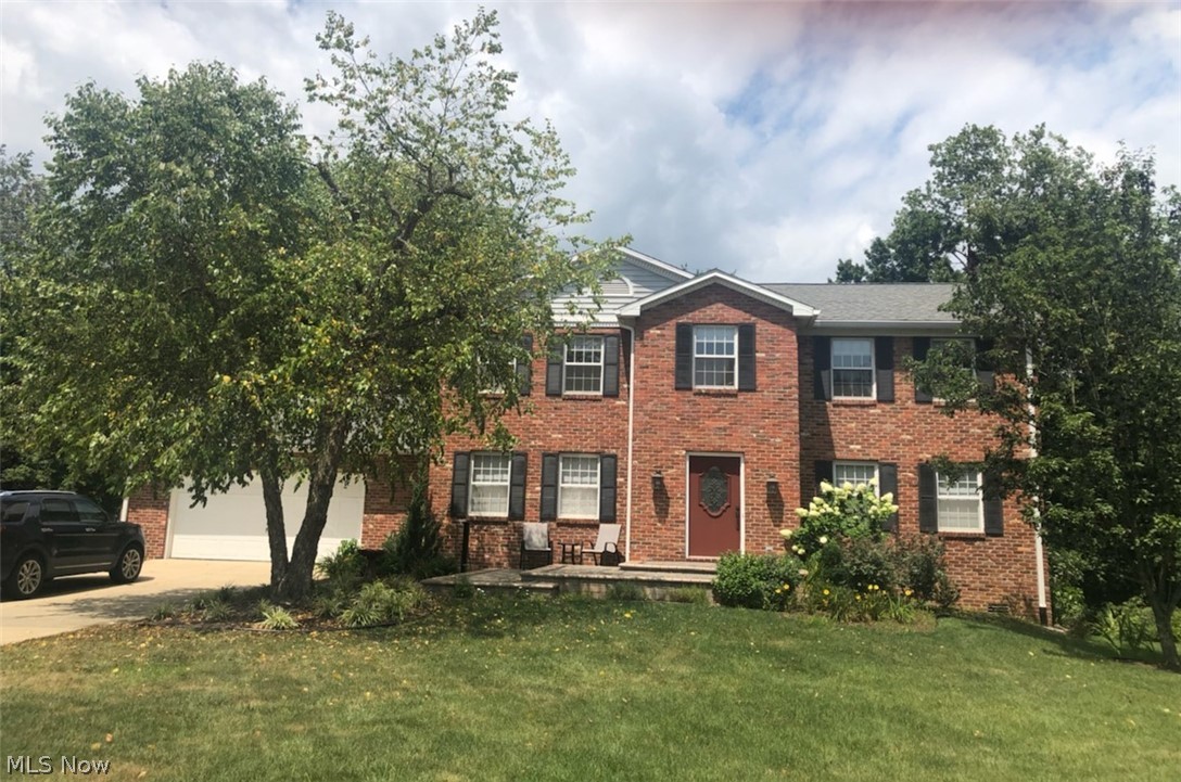 THE WOW FACTOR!!! Gorgeous like new on the inside!!!! All newer carpeting and some hardwood floors on the main level! Huge family room off the kitchen with gas fireplace and floor-to-ceiling windows to take in the view of the lovely tree-lined back yard. Kitchen with many updates...stainless appliances include double convection ovens, Corian countertops and extra bar/countertop for food prep. Great laundry room, formal living and dining and half bath round off the first floor. Four generous bedrooms with ample closet space are all on second floor. Awsome master bedroom with newly renovated en-suite bath with huge tiled shower, double vanities with custom cabinetry and granite countertops. Lovely well maintained covered deck at the back for entertaining and enjoying the wooded view.