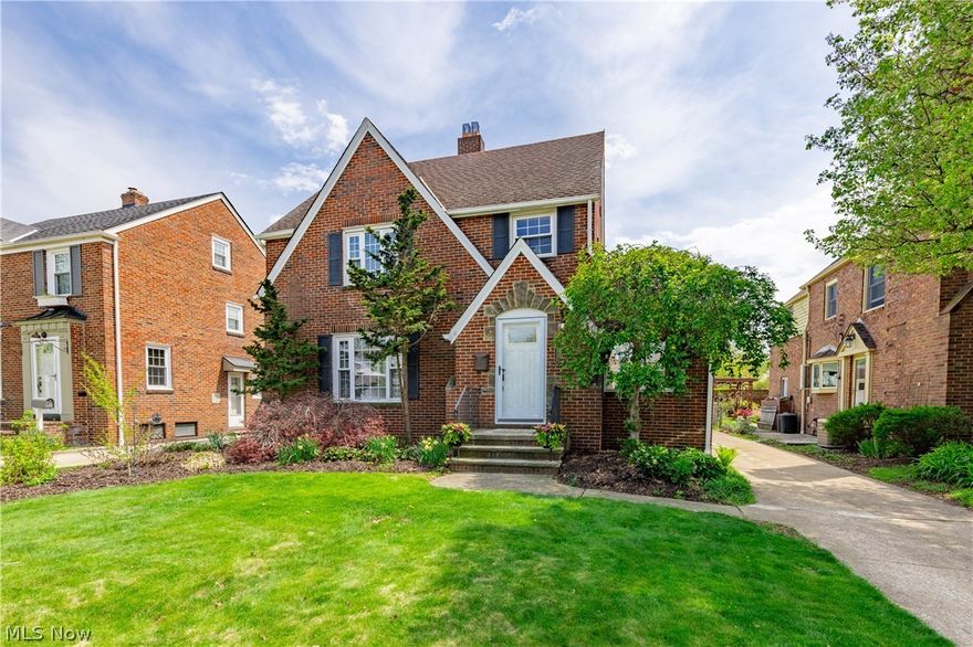 Welcome to 21130 Edgecliff Dr in Euclid, a pristine all-brick home located directly across the street from Lake Erie on a highly desirable street where opportunities like this rarely come available. This home has been meticulously maintained and offers timeless character paired with thoughtful updates throughout. The first floor features a spacious living room filled with natural light, a formal dining area, and a beautifully updated kitchen with upgraded cabinetry, granite countertops, and high-end appliances. Just off the main living space is a stunning sun room, easily one of the most unique and inviting areas of the home, perfect for relaxing year-round. The dining room opens to a large brick paver patio, creating a seamless indoor-outdoor flow that is ideal for entertaining or enjoying a quiet evening. Upstairs, you will find well-sized bedrooms and a clean, well-maintained full bathroom. The finished basement adds valuable additional living space with brand new carpet, making it perfect for a recreation area, home office, or additional lounge space. Recent mechanical updates include a newer furnace and air conditioning system, offering added comfort and peace of mind. The exterior showcases the durability and charm of all-brick construction, complemented by beautifully landscaped grounds with mature trees and vibrant flowers surrounding the property. A two-car detached garage adds convenience and functionality. Beyond the home itself, this property is part of a truly special, tight-knit community known for its friendly neighbors and welcoming atmosphere. It is a beautiful neighborhood to enjoy a walk along the sidewalks with family or pets while taking in the nearby lake views. Optional access to a local beach club adds to the lifestyle appeal, offering even more ways to enjoy everything this exceptional location has to offer. Schedule your private showing today.