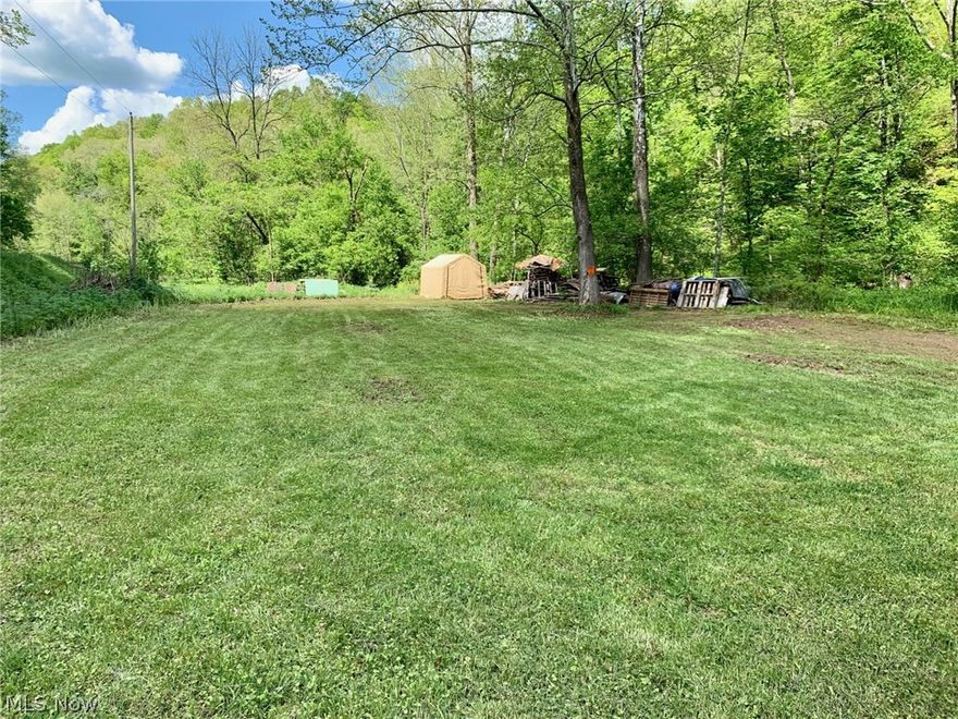 Great hunting or camping tract with established, dried-in shed ready to make your own in Washington County. Fifteenmile creek cuts directly through property. Adjacent at NE corner to 215 acres of Wayne National Forest public lands as well as other surrounding parcels. Recent survey. Electric available at street. No mineral rights convey. .