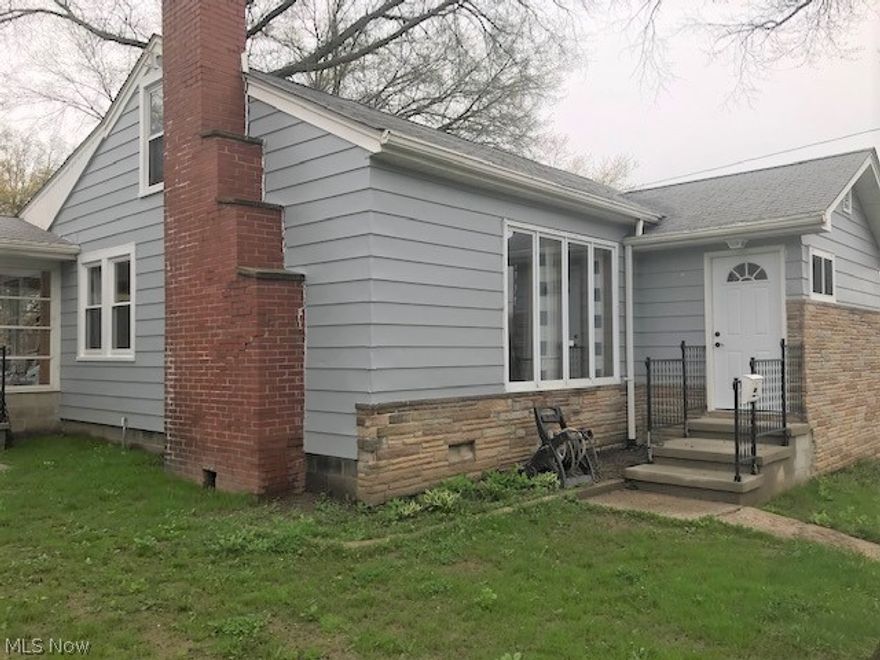 Beautifully remodeled 2BR home with lots of attention to detail! There's nothing left to do, but move-in, relax and enjoy this fully renovated home. Neutral decor throughout. The foyer features barn style closet doors. The open living area features a shiplap accent wall with fireplace. Eat in kitchen with new cabinets, countertop and appliances. Fresh paint and new flooring throughout. Walk out basement with full bath and laundry. Extra parking or patio area on the side of the house. Yard space to enjoy Ohio's summer weather. Furnace and hot water heater have been replaced