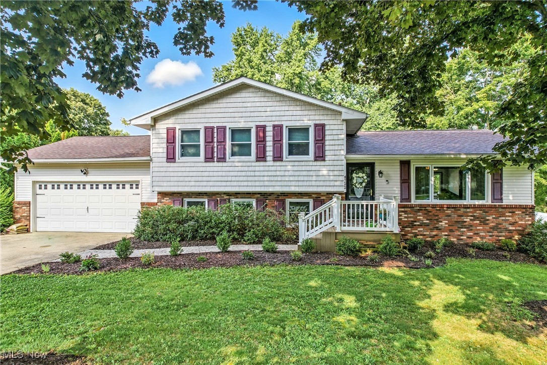 Discover your dream home in the desirable Green Local School District! This meticulously maintained four-level split offers an exceptional floor plan and numerous updates. Step inside to a welcoming living room that leads to a spacious kitchen and dining room, all featuring easy-to-clean vinyl plank flooring. The kitchen boasts a large breakfast bar, perfect for meal prep or quick bites, and patio doors that open to a private deck for outdoor gatherings.
The home's unique layout provides versatile living spaces. The lower level offers a cozy family room with a fireplace, ideal for relaxing on chilly evenings, as well as a fourth bedroom and a full bathroom. A finished rec room and generous storage space are found on the lowest level. Upstairs, the large master bedroom and two additional bedrooms share a full bathroom accessible from the hallway AND the master bedroom.
The fenced-in backyard is a true oasis, offering a peaceful retreat with established raspberry and blackberry bushes, a strawberry bed, organic garden beds, and two apple trees. Enjoy outdoor living on the enclosed rear porch, a perfect spot for a porch swing or even a hot tub.
Major updates include:
2024: Refrigerator, stove, hot water tank, and water softener.
2012: A/C, roof, siding, and shutters.
2009: Windows.
This home combines comfort, modern updates, and a fantastic location to create the perfect place for you and your family.