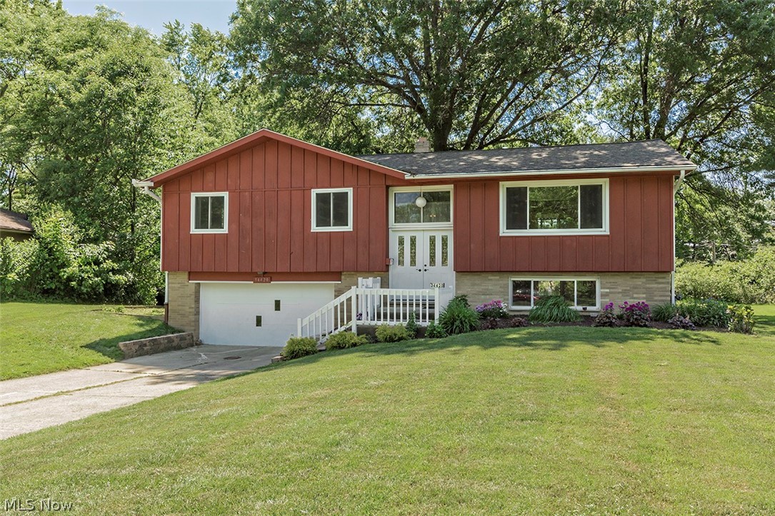 Wow! Welcome to this wonderfully updated bi-level/raised ranch in all HGTV colors located in the heart of Solon! Total house renovation has been done. All hard wood floors on main level have been refinished in June of 2020 ... entire home had been recently painted in the trendy in color of repose gray. The living room features cathedral ceiling, picture window and opened to the kitchen. The kitchen has newer flooring vinyl flooring with all stainless steel appliances staying (purchased January of 2020)! There is a raised deck off the kitchen with views of the expansive private wooded backyard. There is a full bathroom on the main level that had been recently updated. Also master bedroom and 2 bedrooms complete the main floor living. Also attic storage on the main floor along with additional closet space on both levels. All windows, dual front doors, electrical and plumbing have recently been replaced. The lower walk-out level features a bedroom, full bathroom and expansive private rec