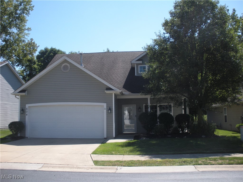 Beautiful Three Bedroom, Two and Half Bathroom Cape Cod Free Standing Condo in a very Quiet Neighborhood. Welcoming Front Porch leads you into the spacious open concept main floor living room. Dining area has a sliding glass door that looks out onto the back porch in the serene backyard. Kitchen has stunning quartz countertops and gorgeous tile backsplash, appliances including refrigerator, range, microwave and dishwasher stay with the home. Primary bedroom has large ensuite, walk in closet, additional large closet for plenty of storage. Upstairs has two generous bedrooms, full bath. Big closets throughout house. Easy access to the attached two car garage. Close to lake, shopping, amenities and highways are easily accessible. This is a free standing condo that lives like a single-family home! Low-maintenance easy living.