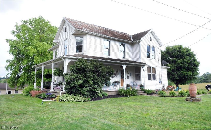 New in 1901, this exceptional residence was built in a time that homes were built with charm & character.  Situated on a 1.56 acre lot, this impressive home offers 4 BR's and 2 full baths; a convenient 1st floor laundry ( half bath).  A beautiful kitchen with upgraded appliances, and a spacious dining room, living room and a family room complete the 1st floor. 4 nice sized bedrooms and a full bath complete the 2nd floor.  The wood floors in the upstairs have been recently refinished.  There is a detached 2 story garage where the possibilities are endless- apt. etc. With a wrap around porch & mature landscaping, this home is a true gem.
