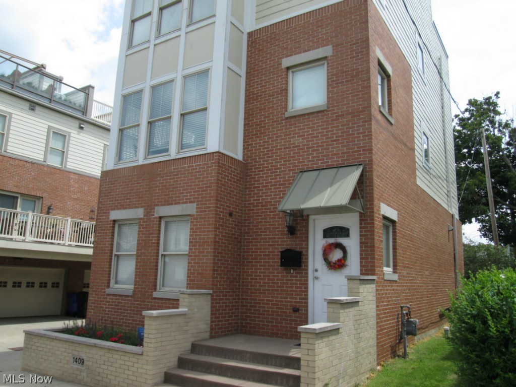 What a Gorgeous Find in Cleveland Just Minutes from Edgewater & Detroit-Shoreway. Three Level Townhouse with Breathtaking Rooftop Deck and Astonishing 2,555 Square Feet of Living Space. First Level offers a Wonderful Bedroom/Office with Full Bath, also Entrance to Attached Two Car Garage and Stairway Leading Down to Full Basement. Second Level Features a Spacious 20x15 Great Room, Half Bath, and Open Gourmet Kitchen Complete with Granite Counters, Island, Breakfast Bar, Stainless Appliances, and Incredible Pantry. Third Level Offers Stunning 17x12 Master Bedroom and Glamour Master Bath along with 2nd Bedroom. Amazing Windows Brighten Every Level of this Gem. Enjoy the Comfort and Conveniences of Downtown Living in this One of a Kind Single Family Home which has NO HOA or MONTHLY MAINTENANCE FEE. Carefree Living with No Yard to Maintain, Just a Front Flower Box. Minutes to all the conveniences of Lake Erie, Downtown Cleveland or Lakewood. Location, Location, Location. What Mo