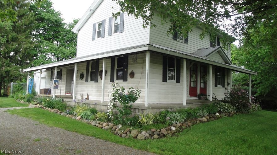 Beautiful country land 5.8 acres.Fenced in back yard . Huge detached garage. Century 2 story home with lots of room to roam! Close to 71.Lots of flowers & trees!