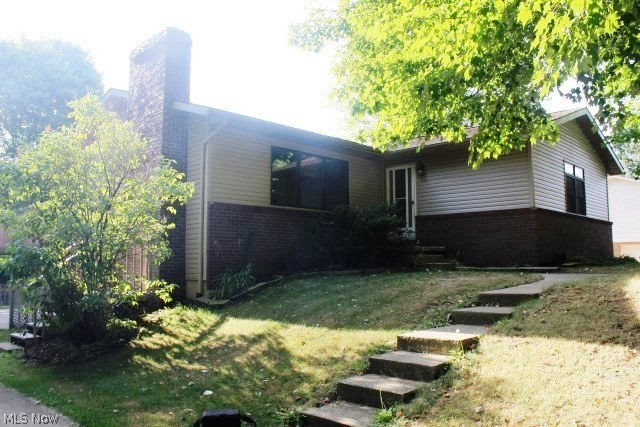 A delightful 3 bedroom, 1.5 bath raised ranch with 1st floor laundry & 1785SF including 391SF in the walk out basement* An absolute move in with neutral décor through out with spacious eat in kitchen with white cabinets, ceramic floor, breakfast bar, pantry & fully applianced (smooth top range, refrig, dishwasher & disposal) & slider to wrap around deck* Living room with brick wood burning fireplace* Updated bathroom with double vanity & ceramic floor* All bedrooms with ceiling fans & walk in closets* Walk out lower level with rec room with wet bar, gas log stove, half bath & glass block windows* Extra deep rear load 2 car garage* Vinyl siding, shingles, furnace & A/C (approx. 7 yrs.)* Hot water heater (2015)* Privacy fenced yard, spacious & private* Plenty of storage area* Immediate possession*