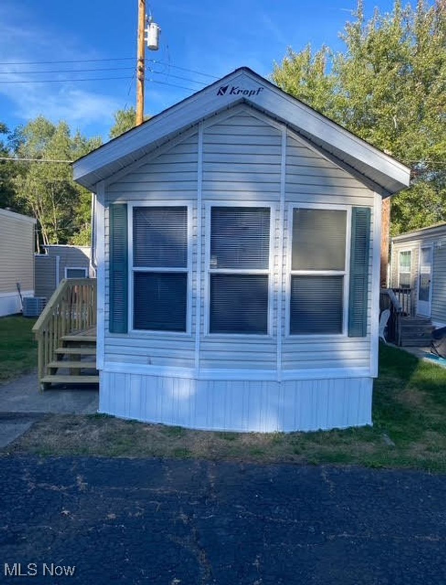 Welcome to this beautifully updated 1999 KROP mobile home located in the desirable Highland Mobile Home Community. This move-in ready home features a full remodel, including all new flooring throughout, updated fixtures, fresh interior paint, and brand-new heating and cooling systems. A fantastic opportunity for low-maintenance, affordable living in a convenient Akron location!