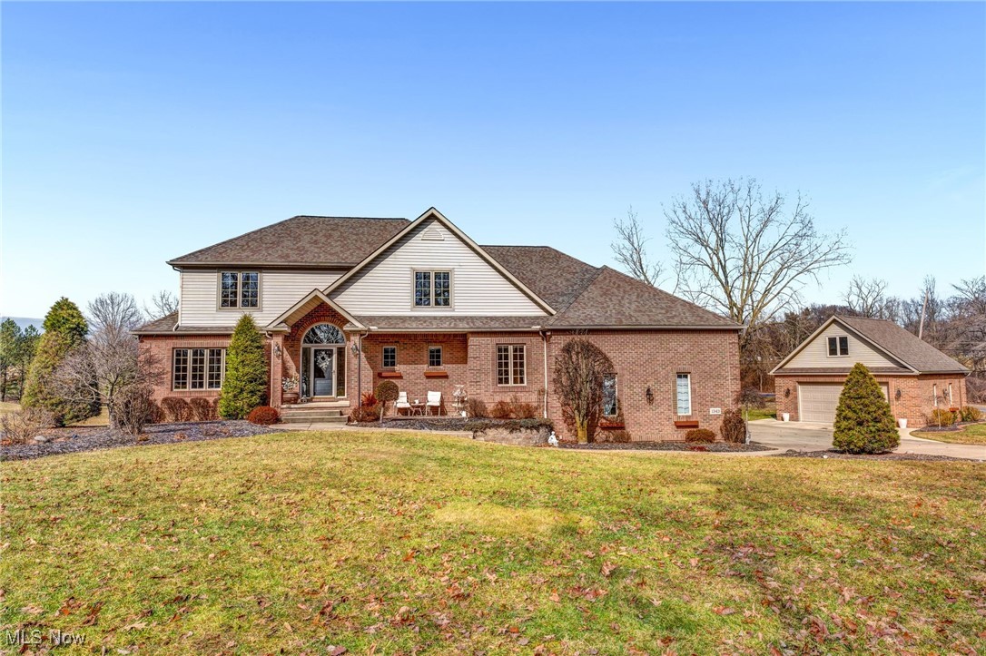 Welcome to your dream home at 1343 Vermillion Dr, New Franklin. This stunning Colonial exudes a perfect blend of elegance & functionality, offering over 4,686 sqft of thoughtfully designed living space set on more than 2 acres of private, tree-lined seclusion. As you enter, be enchanted by the 3/4" maple hardwood floors that seamlessly connect the welcoming living & dining areas. The kitchen dazzles with granite counters & cabinetry atop sleek tile floors, while the spacious family room invites relaxation w/ plush carpeting & a cozy gas/wood-burning fireplace. A convenient 1st floor laundry room boasts modern upgrades w/ granite counters, fresh cabinets, tile floors, & sink, ensuring everyday tasks are a breeze. Upstairs, the master suite stands as a tranquil retreat, featuring a gas/wood-burning fireplace, 2 expansive walk-in closets, & a lavish en-suite bathroom complete w/ a soaking tub & dual shower heads. Three additional carpeted bedrooms provide ample space for family & guests, complemented by a well-appointed full bath. The versatile basement is an entertainer's delight, w/ a rec room that includes a projector screen, kitchenette, a gym, an office, & a full bath. Outside, the backyard beckons with its 2-tier Trex deck—perfect for hosting gatherings—alongside a patio featuring a built-in fire-pit & serene waterfall accents. The sand volleyball court & tetherball add fun, while built-in gas lines offer outdoor cooking ease. A heated 4-car attached garage w/ 16' ceilings, perfect for adding a car lift, & a heated, detached
2+ car garage w/ a hoist complete this exceptional offering. This corner-lot oasis offers desirable proximity to local amenities, blending privacy w/ convenience. Some other notable features include a lawn sprinkler system with its own separate water source & whole house central vacuum system. Don’t miss the chance to call this property your own; contact us today to schedule your private tour & discover the lifestyle you’ve been dreaming of.