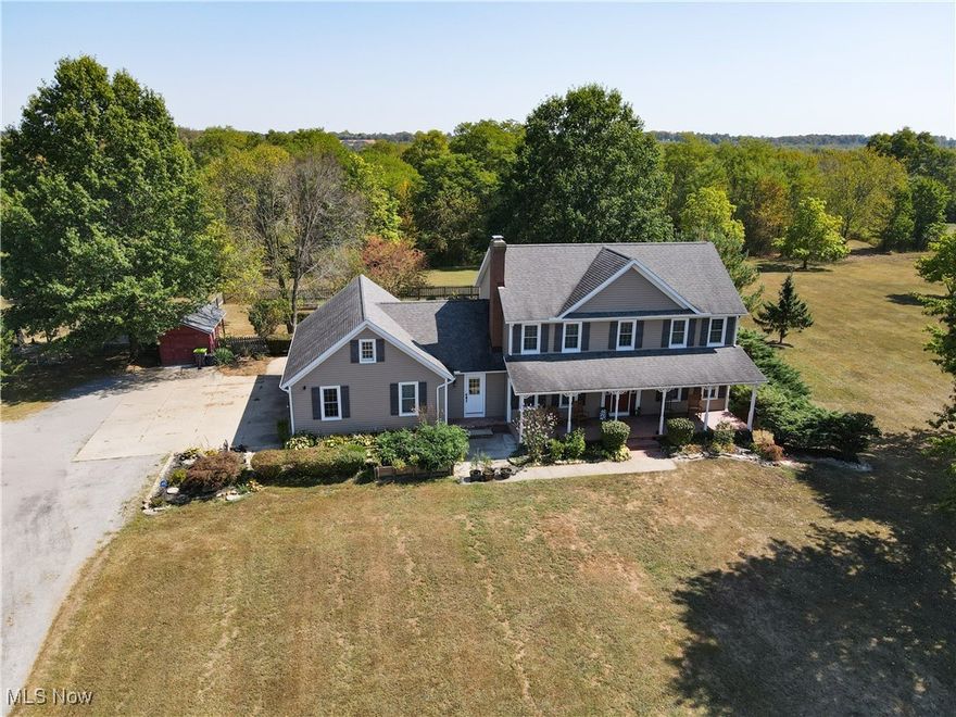 The moment you turn into the driveway, the sweeping view of this 15.49-acre property with a 3 bed, 3 full bath home and 7.5-car garage takes your breath away. Set well off the road for unmatched privacy, the home and outbuildings are surrounded by beautiful land with private wooded trails for exploring, walking, or riding.

Immaculately maintained, the home features a 2.5-car attached garage, wood floors on the main level, a large mud/laundry room with full bath, fireplaces in both the dining and family rooms, and a kitchen with stainless appliances, island seating, and recessed LED lighting. Dual patio doors open to outdoor living spaces and a fenced yard.

Upstairs, the primary suite offers a walk-in closet and additional shelved closet. Two more large bedrooms feature walk-in closets with built-ins. A full hallway bath and extra storage complete the upper level. The walk-out basement—with separate entrance, bonus room, oversized rec room, and ample storage—adds great flexibility.

Major updates: siding (2020), windows (2016), HVAC (2022) with thermostat (2024), washer/dryer (2023), dishwasher (2025), disposal (2022), bathroom vanities (2022 & 2025), toilet (2023), fans (2021), water pressure tank (2025), whole-property water filtration (2021), radon mitigation (2021), septic (pumped 2024), and interior painting (2021–2025).

Outbuildings include a 30x50 barn with hayloft and an insulated/heated 6 run dog kennel (within a fenced acre) with frost-free hydrant; a 5-car insulated steel garage & loft area with heat, A/C, spray foam insulation, insulated doors,(2022) and nearby frost-free hydrant (currently a gym); a refreshed large she shed (exterior updated, painted before transfer); and an 8x8 shed (2022), previously for goats. With pond potential, abundant storage, and meticulous care throughout, this is private country living at its finest.