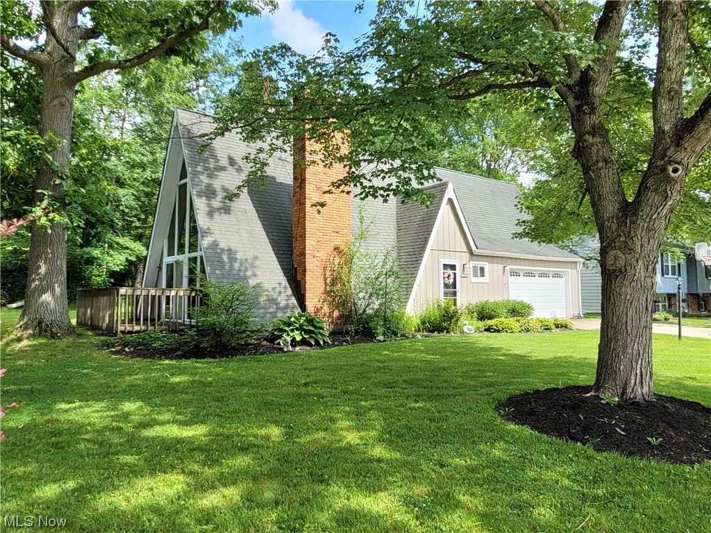Live like you're on vacation in this waterfront A-frame! Stunning architectural details through out. 2 story wall of windows, fireplace, & vaulted wood ceilings in living room with sliders leading to a deck. 2nd set of sliders lead to another deck coming off of the vaulted 4 season room. Private dock in the backyard! New furnace '10. New hot water tank '10. New fridge '20. New stove '21. New dishwasher '23. New garage door & opener '21. New windows on 2nd fl '21. New carpet in living/dining rm '22. New tub/sink/toilet in 2nd fl bath '19-'21. 2nd floor hallway is large enough to easily double as an office/hobby room. 305 acre lake for swimming, fishing, boating, water skiing, tubing, paddle boarding, kayaking, etc. 2 soft sand beaches, 2 in ground heated swimming pools, 2 playground facilities, 4 tennis/pickleball courts, basketball courts, sand volleyball court, baseball diamond, swim team, party center, marina, & tons of planned parties/events for residents. Private dock space availab
