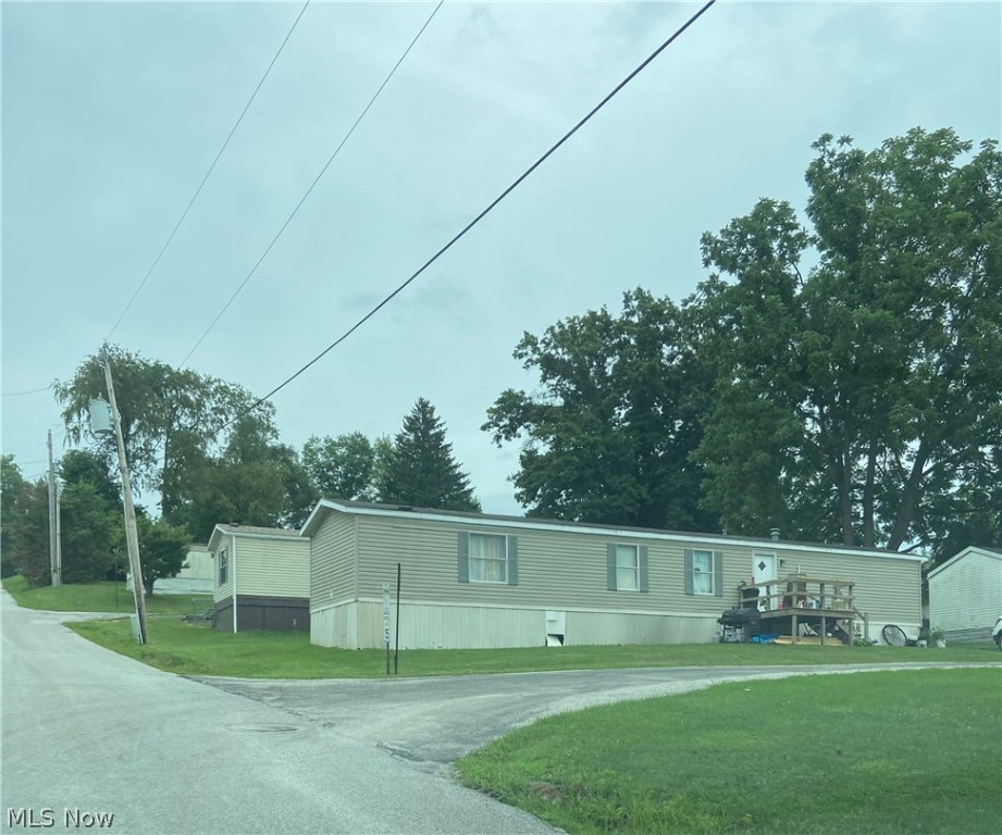 THIS IS A RARE OPPORTUNITY! Owner is retiring. Immaculate 37 unit trailer court in a park like setting on 6.6 acres with a 9 acre adjoining level parcel for future development. City water and sewer, 25 trailers owned by seller, 7 owned by renters. Mineral rights do not transfer. A new survey is being completed. Agent is related to Seller.
