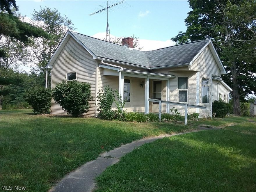 Hilltop setting for this home in the country. Spacious kitchen with plenty of cabinets, laundry arera off kitchen in enclosed porch. Big yard for the kids. $9 assessment for MWCD 9.8 acres with home. 18.95 acres across the road. County water and Guernsey Muskingum electric. New electric hot water tank. Being sold "AS IS" Includes 50% of mineral rights. Active well on property provides free natural gas to home owner. Motivated Sellers.
