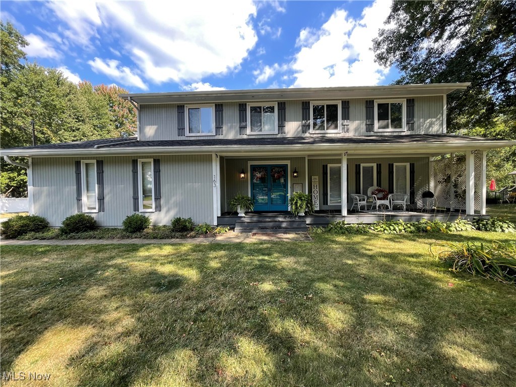 Welcome to this spectacular 4-bedroom Colonial located in the highly sought-after Revere School District! The current owners have thoughtfully brought this home into the 2020s with stylish modern updates throughout. Inside, you’ll find updated bathroom lighting, artfully selected paint in the upstairs bedrooms and bathrooms, and green guard certified luxury vinyl tile in the second floor bedrooms and the basement, creating a fresh and cohesive feel. The Living Room, Formal Dining Room, and spacious Family Room all feature hardwood flooring. The Family Room also offers a gas log fireplace and access to the deck through sliding doors—perfect for indoor-outdoor living. The primary suite boasts cathedral ceilings, a walk-in closet, and a beautifully renovated bath. A large finished room in the basement offers versatility as a home office, playroom or 5th bedroom. There’s also a partially finished recreation room in the basement that can be used as a workout room, workspace. Both add charm and functionality. Additional features include updated 150 AMP electrical service, glass block windows, and city water. The exterior is equally impressive with adorable teal double front doors, raised vegetable gardens, a brick fire pit, lush landscaping, and a generous ½ acre corner lot—ideal for relaxing, entertaining, and grilling. Lovingly maintained with care, dedication, and attention to detail, this home is move-in ready and full of character. Green