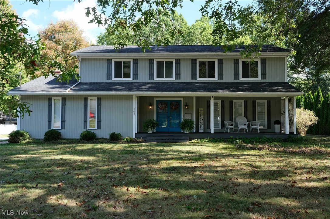 Nestled on a large lot in the sought after Revere School District, this spectacular 4 bedroom, 3 bath, Colonial offers stylish and modern charm. The home is surrounded by mature oak trees and raised garden beds. It is conveniently located minutes away from top restaurants, shopping, and access to route 77. Enter the home through a covered front porch with double doors. The center-hall foyer leads you to sliding barn doors that give the generously sized family room the option of privacy. French doors guide you from the family room into the dedicated dining room with dimmable lighting to set the tone for hosting family and friends. The eat-in kitchen, with its stainless-steel appliances, transitions into the spacious living room complete with a brick fireplace, ceiling fan, and sliding glass doors. The living room overlooks the patio, half acre backyard and gardens, creating a relaxing and serene atmosphere that is perfect for hosting. Upstairs, you will find generously sized bedrooms and freshly painted bedrooms, which feature new GreenGuard luxury vinyl tile and closets that have built-in shelving. You will also find two full bathrooms with sleek cabinetry and contemporary lighting for a stylish look. A bright and airy master suite offers a vaulted cathedral ceiling, a spacious walk-in closet, and an adjoining master bath for added convenience and comfort. In the basement, you will find a newly finished multi-purpose room with luxury vinyl tile, which can serve as a home office, playroom, or fifth bedroom. Behind the finished room is a large space that is ideal for a workshop, a gym, and/or recreation room. Finally, you will discover a large utility room, with a washer and dryer and walk-in storage closet. This move-in ready home is designed for both comfort and style. A home warranty plan is being provided for your convenience and peace of mind. Don’t miss the opportunity to make this beautiful home your own!