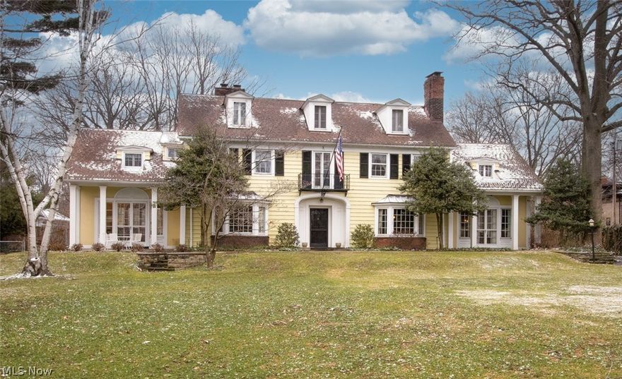 This abundantly light-filled Center Hall Colonial is situated on approximately one captivating acre in historic and sought-after Ambler Heights, a unique neighborhood minutes from University Circle's world-renowned offerings including the Cleveland Museum of Art, the Cleveland Orchestra, hospitals, universities, restaurants, and galleries. The location is among the most coveted neighborhoods in Northeast Ohio.  2215 Devonshire Drive offers six bedrooms, four full and one half baths. Built in 1916, this stately home offers extraordinary detail and woodwork throughout: bay windows in the living room and wood-paneled library, exquisite center-hall landing, etc. Central air conditioning was added to the owner’s suite (Bedroom, Bathroom, and oversized Dressing Room). The spacious kitchen was reimagined 10 years ago and offers two Butler’s Pantries with access to an attached and heated 3-car garage, rare in homes of this age. The current owner has lived in the home for over 50 years.  This h