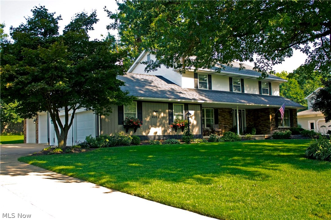 Beautiful, move-in ready home just minutes from Belden Village located in Jackson's Amesbury Hills. Home has 4 bedrooms and 3.5 baths and features a custom-finished basement with kitchenette, full bath with jetted tub, and gas fireplace. The finished basement has gorgeous painted woodwork and is perfect for entertaining. The second room in the basement makes a great storage space and work room and has an additional set of stairs that lead to the oversized 4-car garage. Traditional oak moldings run throughout the home, with crown molding in the first floor rooms. Hardwood floors in the kitchen and foyer. Private, partially fenced-in backyard is perfect for enjoying dinner on the covered back porch. Home features many great updates: renovated kitchen (2014), new furnace and A/C (Dec. 2013), and updated bathrooms (2014) to name a few. Other features include a home security system, first floor laundry, complete lawn sprinkler system, and Andersen windows and storm windows. The home and lan