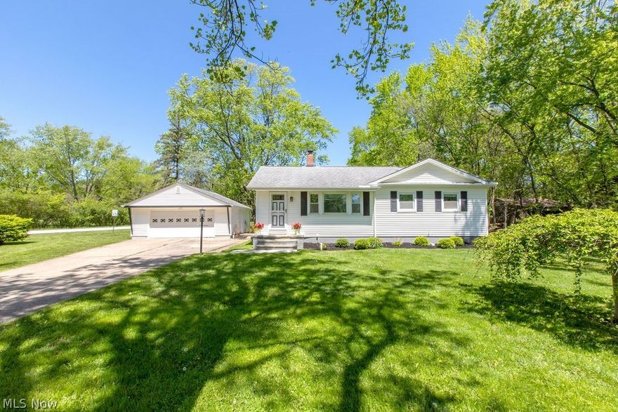 Welcome home to this charming, move-in ready ranch in the highly sought after Revere Local School District. Built in the 1950s, this 3 bedroom, 1 bath home blends timeless character with the peace of mind of major updates already completed. Original hardwood floors flow throughout the living room and bedrooms, adding warmth and charm. The updated kitchen and bathroom offer modern convenience while maintaining the home’s classic appeal. A spacious dining room provides the perfect setting for gatherings and everyday living.
Outside, enjoy the privacy and beauty of the expansive 1-acre lot featuring a stamped concrete patio ideal for entertaining or relaxing evenings at home. The oversized 2-car garage offers plenty of storage and workspace. The unfinished lower level provides endless possibilities and even includes a nostalgic 1950s kitchen — a rare and fun nod to the home’s history.  Updates include - apprx dates- Furnace 2016,A/C 2024, Roof 2016, HWT 2023.This is the perfect opportunity to enjoy ranch living with character, space, and updates in an incredible location.