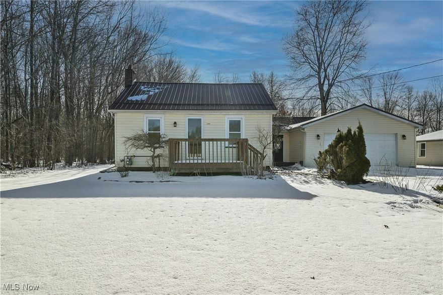 A charming, move-in-ready country home with classic 1940s character and modern comfort—perfect for anyone seeking peaceful living just minutes from Warren and surrounding towns. A cozy and updated 1-2-bedroom, 1-bath ranch set on a 0.5-acre wooded lot, offering privacy, simplicity, and low-maintenance living. Comfortable layout ideal for small households, downsizing, or investment. Beautiful brand-new updates to include, full bathroom, carpet, flooring, kitchen sink, exterior light fixtures and interior doors. Front porch and deck painted 2025. Metal roof, furnace and h2o tank approx. 5 years. Enjoy nature, privacy, and room to garden or relax outdoors. Full basement with glass block windows. Convenient 1st floor laundry in nicely finished off breezeway.  2-car attached garage. Includes electric, drain, and opener—perfect for vehicles, workshop space, or equipment. Deck overlooking the back yard which is a peaceful spot for morning coffee or evening unwinding. Seller is adding a 1-year home Warranty for added peace of mind.