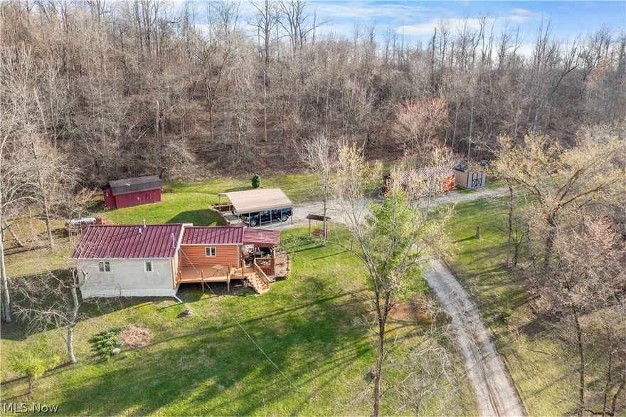 Country retreat or hunters haven! With over 10 acres mostly wooded and a great view from the covered porch or in the swing overlooking the land. With many updates throughout including new metal roof in 2019, windows in 2020, Doors 2023. updated Kitchen, Carport 2022, Yoder 12x20 building 2018, and more. Schedule your time today to walk the property and take a look at this property before it is gone.
