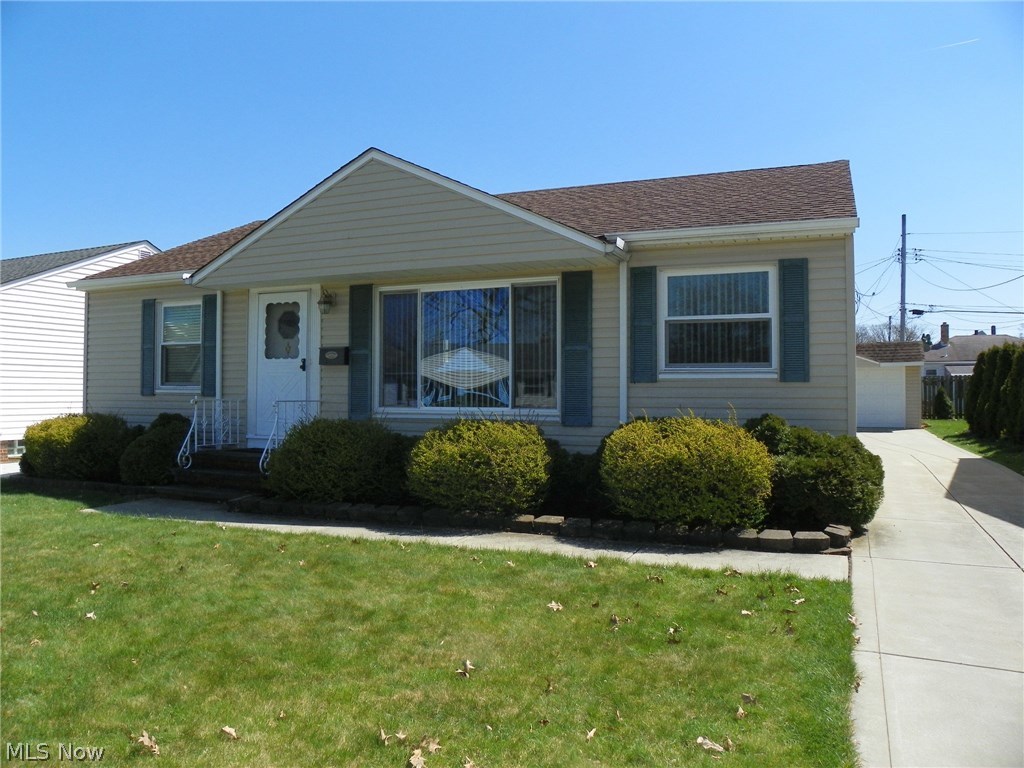 Cozy Ranch with 3 Bedrooms and 1-1/2 Baths * Updated vinyl siding * Newer driveway * Updated electrical * Newer roof * Large Living Room/Dining Room combo * 12 x 12 enclosed patio * Recreation Room in the partially finished Basement with glass block windows and a 1/2 Bath * 50' frontage * Surround sound stays * Home warranty provided with this home ! *