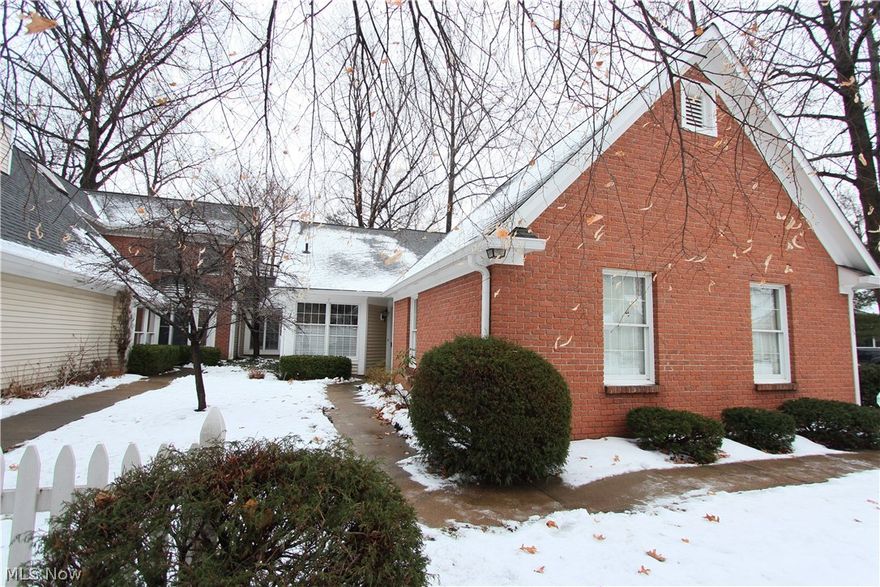 Follow your Dreams to this One of a Kind Westwinds Condo in beautiful Avon Lake with all the amenities you are looking for in maintenance free lifestyle! Tucked away in the quiet and private setting of 225 Westwind Dr. this two story home will wow you as soon as you enter. Meticulously redone from top to bottom with clean crisp detail. The new laminate flooring leads you in to the dramatic new eat in kitchen and 2 story vaulted family room with warm fireplace and a nook / office looking out to the private setting perfect or bird watching or private outside enjoyment. The New Granite kitchen is clean and cozy with eat- in option light and bright. First floor master with ample closet and master bath and first floor laundry complete the first floor. New Carpet upstairs in the bonus sitting loft and second bedroom. Full Bath and bonus storage room. New Furnace, Hot water Tank. Sprinkler & Security System