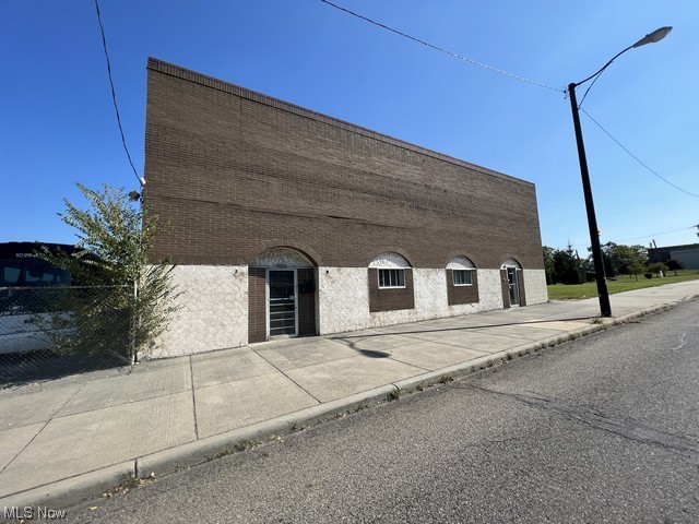 Vacant warehouse, with office space on second floor, many possibilities , 18 foot ceilings , overhead door in rear of building