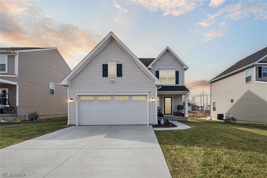 This spacious beautiful four bedroom, two and half bath home is move-in ready! Built in 2019 in the Meadow View community, this home is open-concept with durable laminate countertops, stainless appliances and subway tile backsplash! Cathedral ceilings and lots of natural light are attractive features of this home. The fenced back yard.  Second floor laundry, three bedrooms, two full baths.  The main level has a powder room, a large living room, dining area and eat-in kitchen. The finished lower level has a bedroom, potential full bath. The home also has an attached two-car garage with water. Conveniently located near Ohio Turnpike, State Route 14, dining and shopping, this home won’t last long!