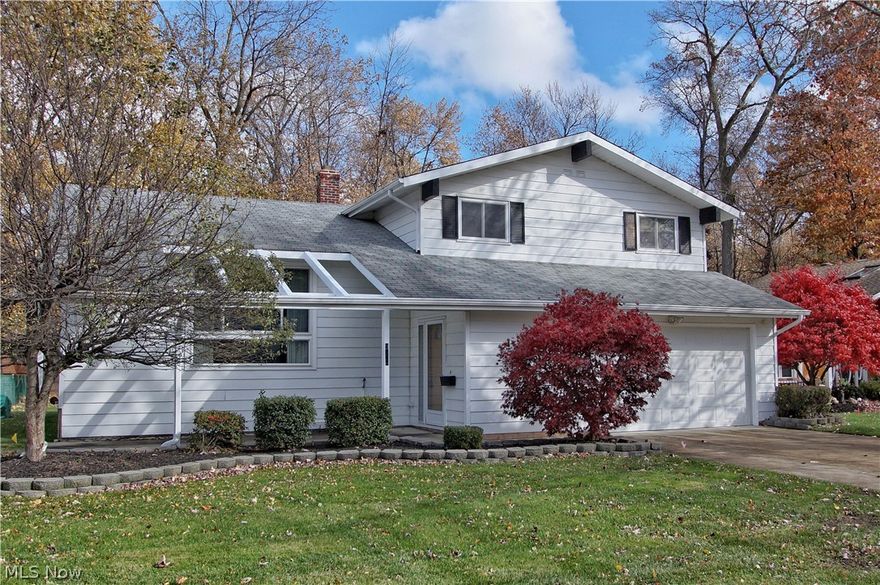 Sharp, spacious and clean 4 level split has a lovely partially fenced yard and cement patio (2007) off Family Room that has brick full wall and wood burning fireplace. You'll love the 2015 remodeled main level second full bath and additional 5X5 dressing area w/sink off upper level full bath to master suite with balcony. Fully finished rec room could opt for 4th bedroom or suite, features beautiful doors and moldings. Laundry room has added 8x9 storage room with counter top and shelves. Could also make a nice computer rm/office station.  Home is well maintained. Many windows and some carpet replaced 2010-2016. Wider cement driveway and garage floor replaced-2007. Nice front and rear patios to relax or entertain. All kitchen appliances included. Seller providing 1 yr home warranty and available for immediate occupancy. Great Value!!