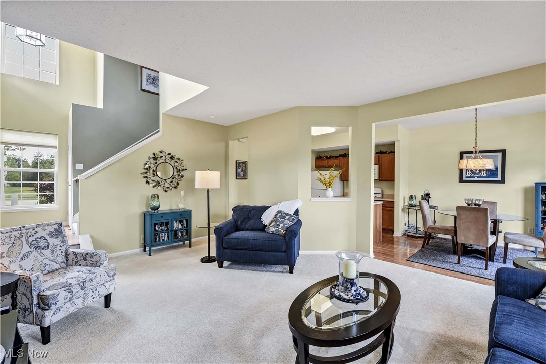 Don’t miss your chance to own this rare 3-bedroom end-unit townhome at 8581 Dunham Drive in Olmsted Township! Tucked within a well maintained community, this standout home offers the perfect blend of privacy, space, and style. From the moment you arrive, the private side-entry walk-up sets the tone for something special. Step inside to a bright, welcoming foyer that opens to a spacious, light-filled living room—ideal for relaxing or hosting guests. The open-concept flow continues into the dining area and kitchen, featuring a gas range, pantry, and a convenient pass-through that keeps the conversation going while you cook. Upstairs, you'll love the versatile loft—perfect for a home office, play area, or cozy reading nook. The stunning primary suite is a true retreat, complete with a sitting area, walk-in closet, and private en-suite bath. Two more spacious bedrooms, a second full bath, and a convenient second-floor laundry room make everyday living a breeze. Step outside to one of the larger yards in the community, featuring mature trees, accent lighting, and a private patio—your own outdoor oasis! A two-car attached garage adds to the everyday convenience of this incredible home, which is ideally located near schools, shopping, and dining. Move-in ready and full of charm, this townhome checks all the boxes—schedule your showing today and experience it for yourself!