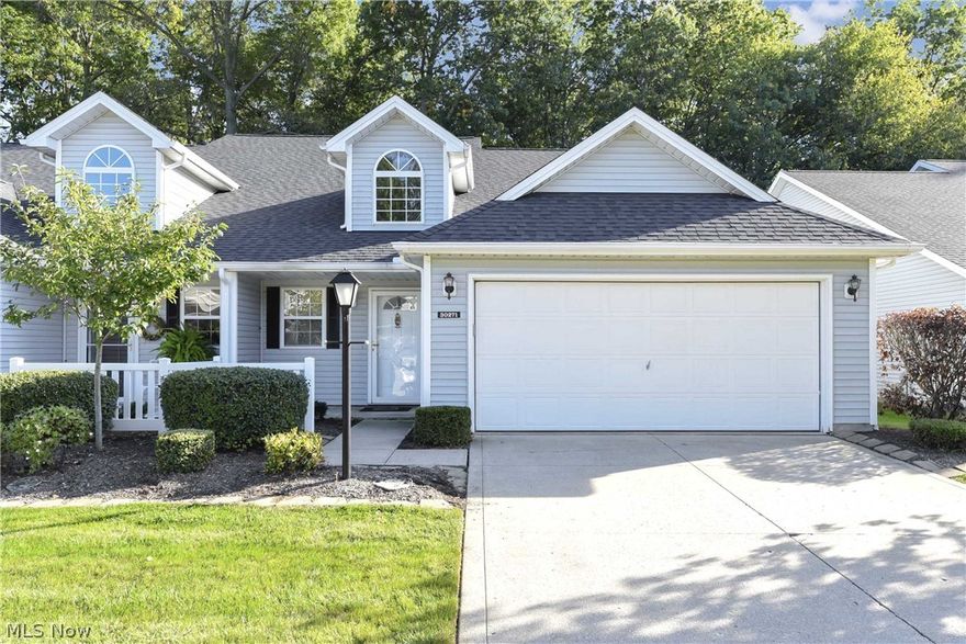 Prepare to be Moved!...into this spacious townhouse in North Olmsted. Desirable end unit in a beautifully wooded setting with plenty of room on two levels. Step up to the inviting front porch and into the foyer.  Soft neutral tones & large windows provide a bright and airy atmosphere in the vaulted living room while the fireplace makes a cozy focal point.  Efficiently designed kitchen, with new paint and flooring, has great cabinet & counter space.  Eat-in area features slider door access to the back patio and wooded views. Step-saving laundry/mudroom and ½ bath just off the kitchen.  Master Suite features an in-suite bath with large stall shower and vanity.  Upstairs, two additional bedrooms share the 2nd full bath. Attached 2-car garage with opener. Newer roof and gutters. Such a quiet, tranquil setting, it’s hard to believe you’re just minutes from shopping, dining, recreation & easy highway access. Immaculately maintained & ready to move - it will become your easy-living dream come