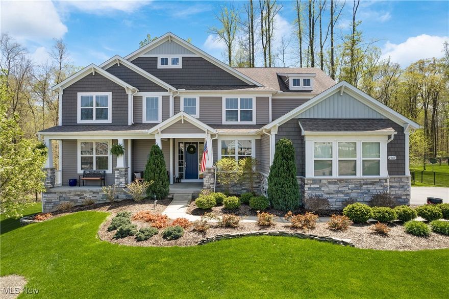 Welcome to this stunning, model-like colonial nestled on a private, wooded cul-de-sac in the well sought-after McFarland Woods!  Step into the grand 2-story foyer and immediately feel the warmth and elegance that defines this home, including the dramatic staircase featuring elegant aluminum spindles. A floor-to-ceiling stacked stone fireplace anchors the substantial 2-story great room, while the adjacent gourmet kitchen is a chef’s dream—granite countertops, backsplash, expansive island w/pendant lighting, stainless steel appliances, gas range w/hood, double ovens, and a large walk-in pantry. Perfect for entertaining or relaxing with family, the main level includes a butler’s pantry w/wet bar and a first-floor custom office with built-ins and granite countertops. Well appointed wainscoting and crown molding throughout! A private first-floor in-law suite w/a walk-in closet and ensuite bath offers ultimate flexibility for guests or multigenerational living. Upstairs, you’ll find four generous bedrooms and three full bathrooms, including a serene primary suite w/ a spa-like bath—complete with soaking tub, separate shower, and a large walk-in closet. A versatile loft area currently functions as a personal gym. The fully finished lower level adds even more living space w/a custom bar and additional beverage coolers, home theater, recreation room, full bath, regressed windows for natural light, and abundant storage. Enjoy seamless indoor-outdoor living with a covered front porch, covered back porch, and a composite deck overlooking the fenced-in backyard and wooded surroundings. A 3-car garage, irrigation system,  landscaping and smart storage solutions make daily life easy and elegant. Just minutes from Chagrin Falls Village with quick access to shopping, dining, and four local parks—including Frohring Meadows—this home offers the combination of nature, convenience, and luxury living in the Award-Winning Kenston School District.