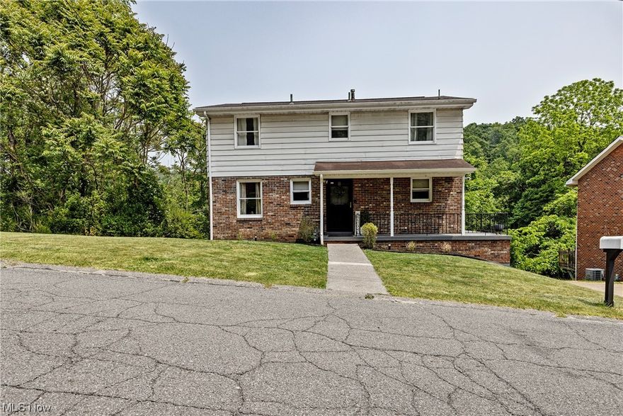 Welcome to this spacious five bedroom, one and a half bathroom home is located in the heart of Weirton, close to all amenities. This two story home features a turn-key feel throughout every room; including a large living room, dining room, and kitchen perfect for hosting guests. This home offers five spacious bedrooms, four located on the second floor and one located on the main floor, all are generously sized with plenty of storage space and windows to draw in the natural light. The full bathroom is clean and airy, featuring a full bathtub and shower. The main floor offers a modern half bath, perfect for guests. A paved driveway leads to an attached one car garage. Other amenities include an unfinished basement with much potential to create personalized space or can be used for extra storage. A large side yard with a patio area is perfect for enjoying the beautiful weather, or for the family to enjoy outdoor activities.