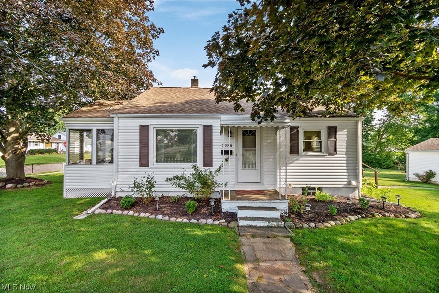 This adorable Massillon home is just what you have been waiting for! Situated on large corner lot, with mature trees and fresh landscaping, you will not want to miss out on viewing this one! This home features 2 generously sized bedrooms, a full bath, a large eat in kitchen and living room. Enjoy your coffee on the back deck or the sunroom, both of which have been freshly updated this year! Many major updates within the past year including exterior and interior insulation, a new hot water tank, paint, flooring and more! Major updates within the past 11 years include new windows, roof, furnace and AC! Schedule your showing today, this one will not last long!