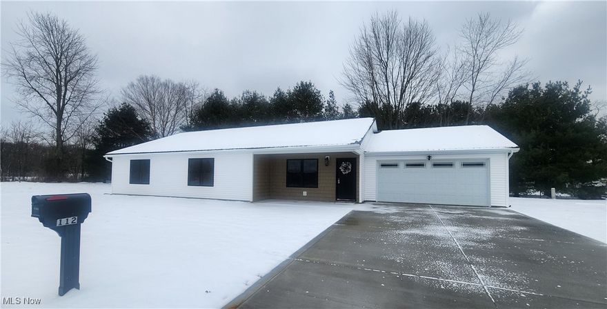 This brand-new ranch style home is both stylish and functional with vaulted ceilings and a modern open concept design. The kitchen features solid surface countertops, cabinets made in the USA, a pantry and stainless-steel appliances. It offers a nice master suite and 2 additional spacious bedrooms, a separate laundry room, and an attached 2-car garage. You can enjoy the benefits of a new construction including a metal roof and waterproof luxury vinyl plank flooring throughout. Sitting on a dead-end street, this property is on the outskirts of town and just 6 minutes to New Philadelphia.