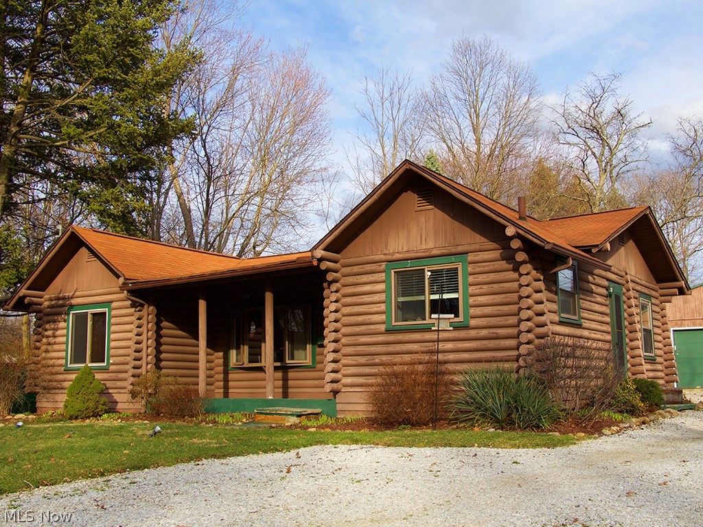 One of a kind! This charming rustic log cabin is located in the heart of Stow. You can feel the coziness the rich warm wood offers as it glistens from the hot embers burning in the magnificent stone fireplace. The living room boasts vaulted ceilings and gorgeous wood flooring. An updated kitchen includes white cabinetry, stainless steel appliances and slate flooring. The first-floor full bath has been update and features a pedestal sink. There are three bedrooms that complete the first level. Moving down to the impressive lower level, you will find a spacious family room that includes a butler’s pantry that offers room for a wine refrigerator. The full bath has been remodeled to perfection. There is still loads of unfinished space in the basement for storage or possibly a room addition. Situated on a large lot, you can enjoy the outdoors on the patio or relaxing on the front porch. The oversized 2car garage lends plenty of space for your outdoor extras. 3559 Marcella Ave is a