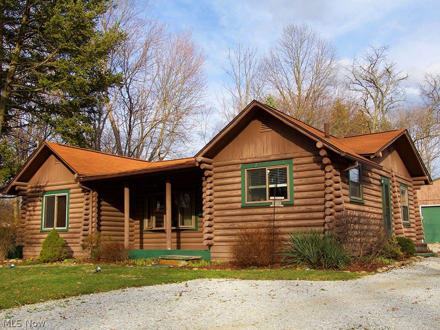 One of a kind! This charming rustic log cabin is located in the heart of Stow.  You can feel the coziness the rich warm wood offers as it glistens from the hot embers burning in the magnificent stone fireplace.  The living room boasts vaulted ceilings and gorgeous wood flooring.  An updated kitchen includes white cabinetry, stainless steel appliances and slate flooring.  The first-floor full bath has been update and features a pedestal sink.  There are three bedrooms that complete the first level. Moving down to the impressive lower level, you will find a spacious family room that includes a butler’s pantry that offers room for a wine refrigerator. The full bath has been remodeled to perfection.  There is still loads of unfinished space in the basement for storage or possibly a room addition.  Situated on a large lot, you can enjoy the outdoors on the patio or relaxing on the front porch.  The oversized 2car garage lends plenty of space for your outdoor extras.  3559 Marcella Ave is a