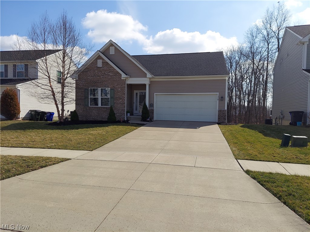 Huge, beautiful ranch in Ryan Homes Development! So much larger than it looks! Open concept with LR, DR and KT. 3 bedrooms and 2 full baths on main floor, large closets, wonderful kitchen has anitqued, white, soft-close cabinets, stainless appliances, gas stove, large island that opens to the vaulted family room. First floor laundry. Extra lower level suite w/kitchen, LR, huge bedroom, bath, weight room and walk-out doors. Upstairs is another room for an office with glass doors or could be a 4th bedroom. Also dining room leads to deck overlooking the woods. If you need a rare huge ranch you will love this one!